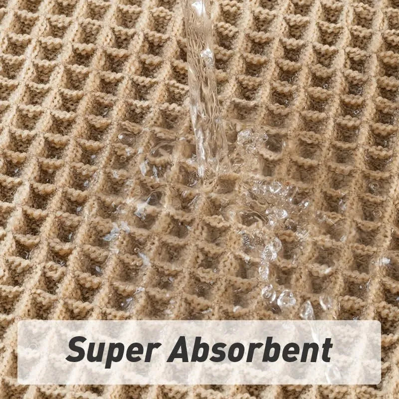 Checkered pattern non-slip polyester bathroom mat in beige colour on tiled floor.