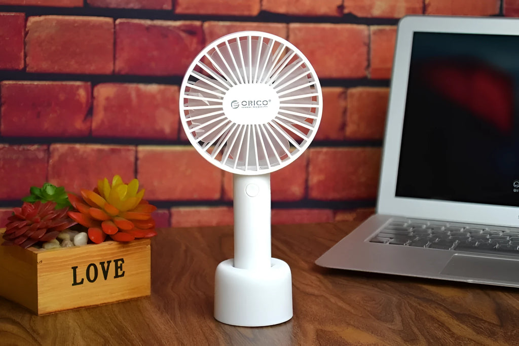ORICO FH1 white portable USB desk fan with rechargeable battery shown on a desk