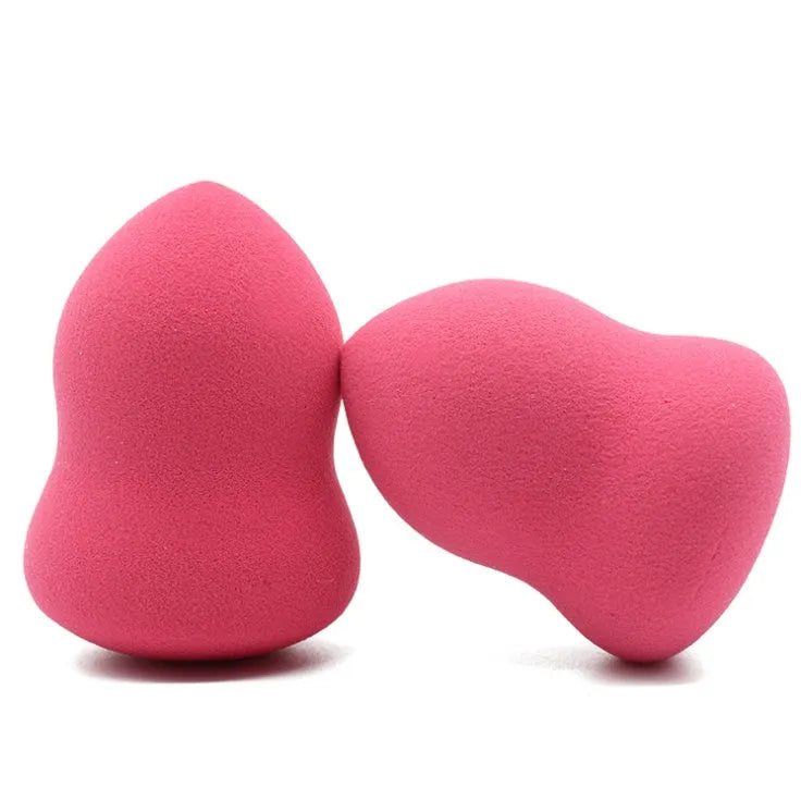 Pink hydrophilic non-latex makeup foundation sponge puff on a white background