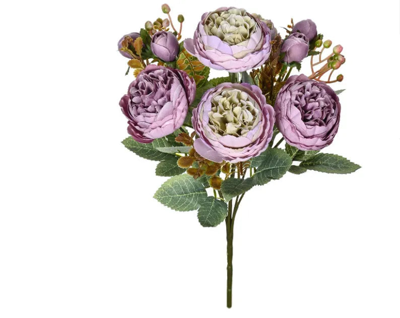 Artificial silk peony bouquet in a champagne colour for home or wedding decoration.