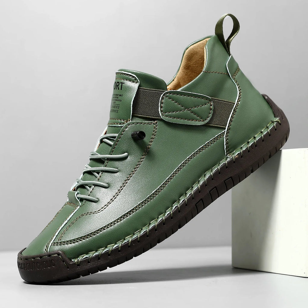Men's mid-calf Martin boots in khaki with tooling stitching and an elastic band closure.