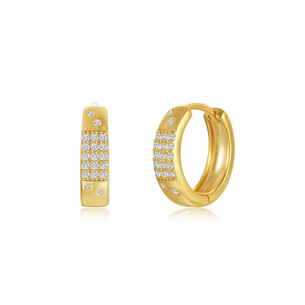 A pair of round, geometric brass earclip earrings with a gold electroplated finish.