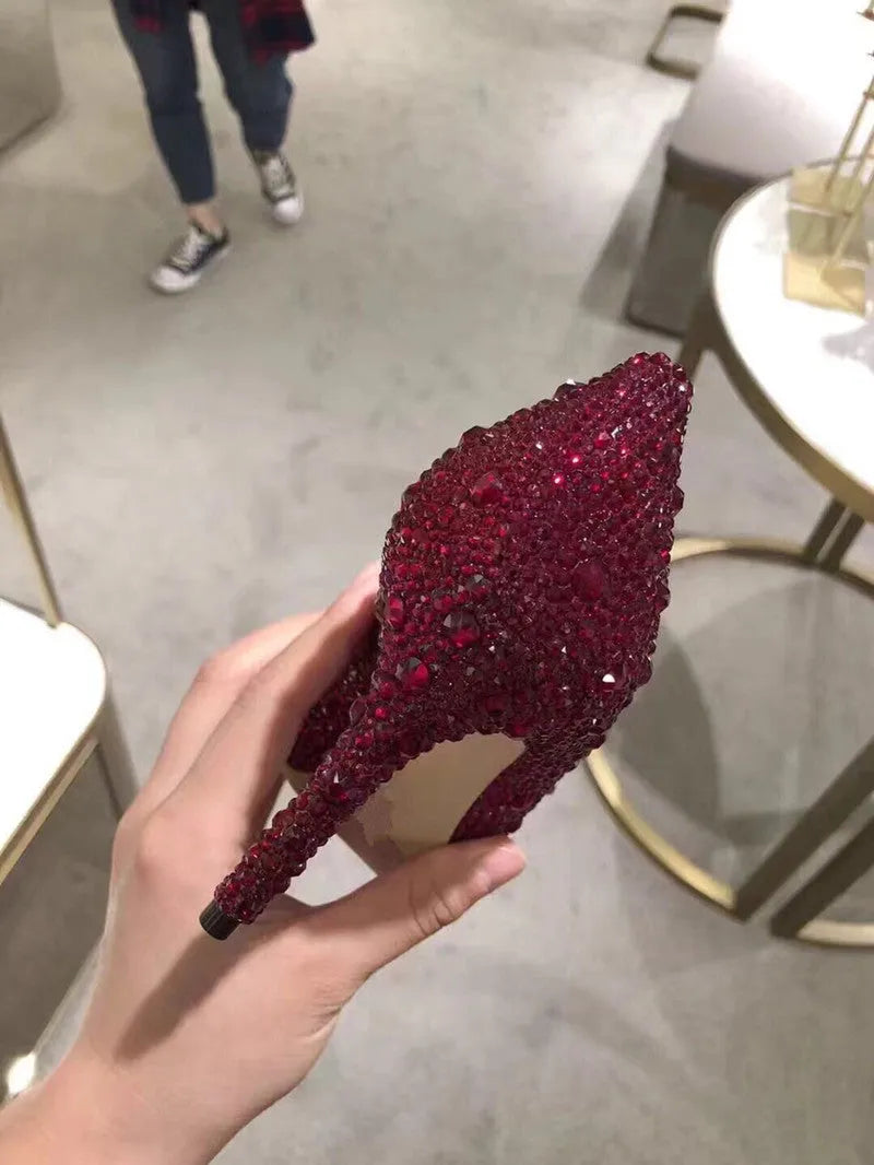 Women's gold pointed toe high heels with rhinestone and bow decoration on sequin cloth