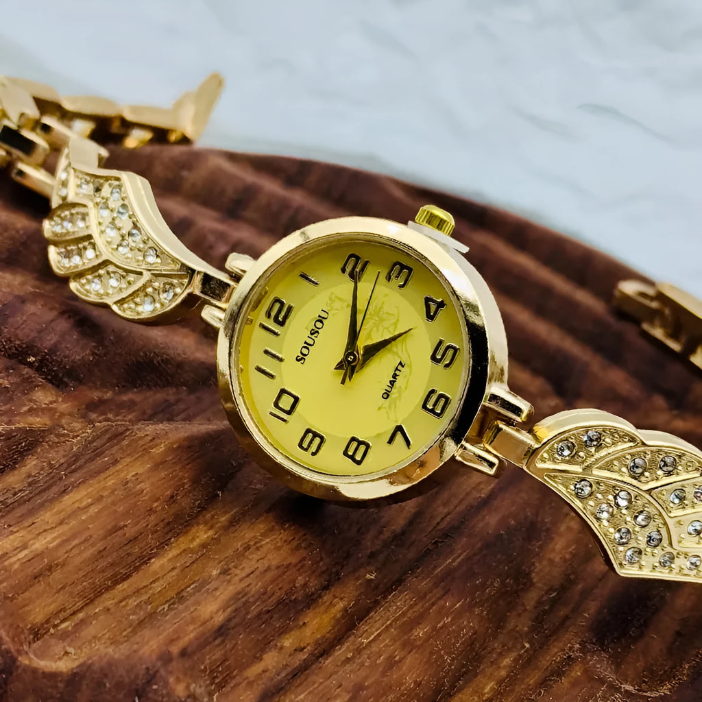 Women's stainless steel watch with round dial showing gold face colour option and Vachette clasp buckle