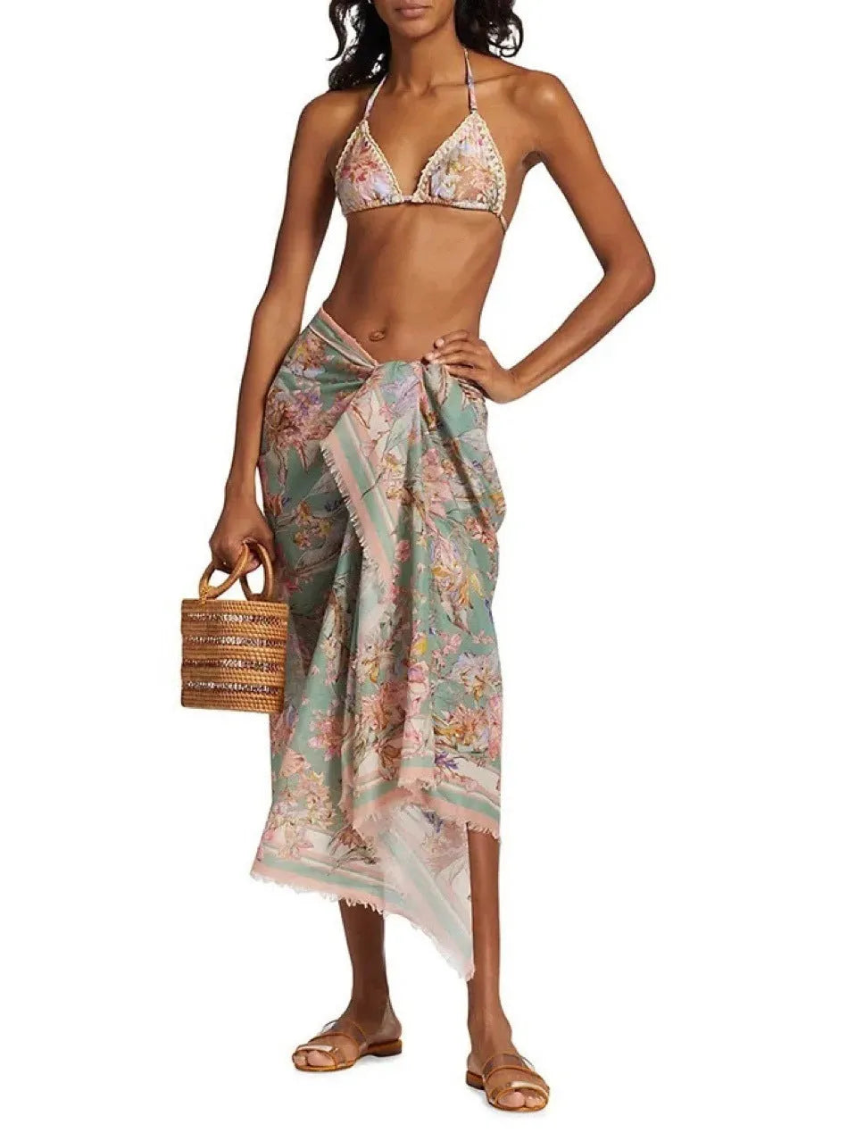 Women's floral print bikini set with skirt in creamy-white beige, shown on a mannequin
