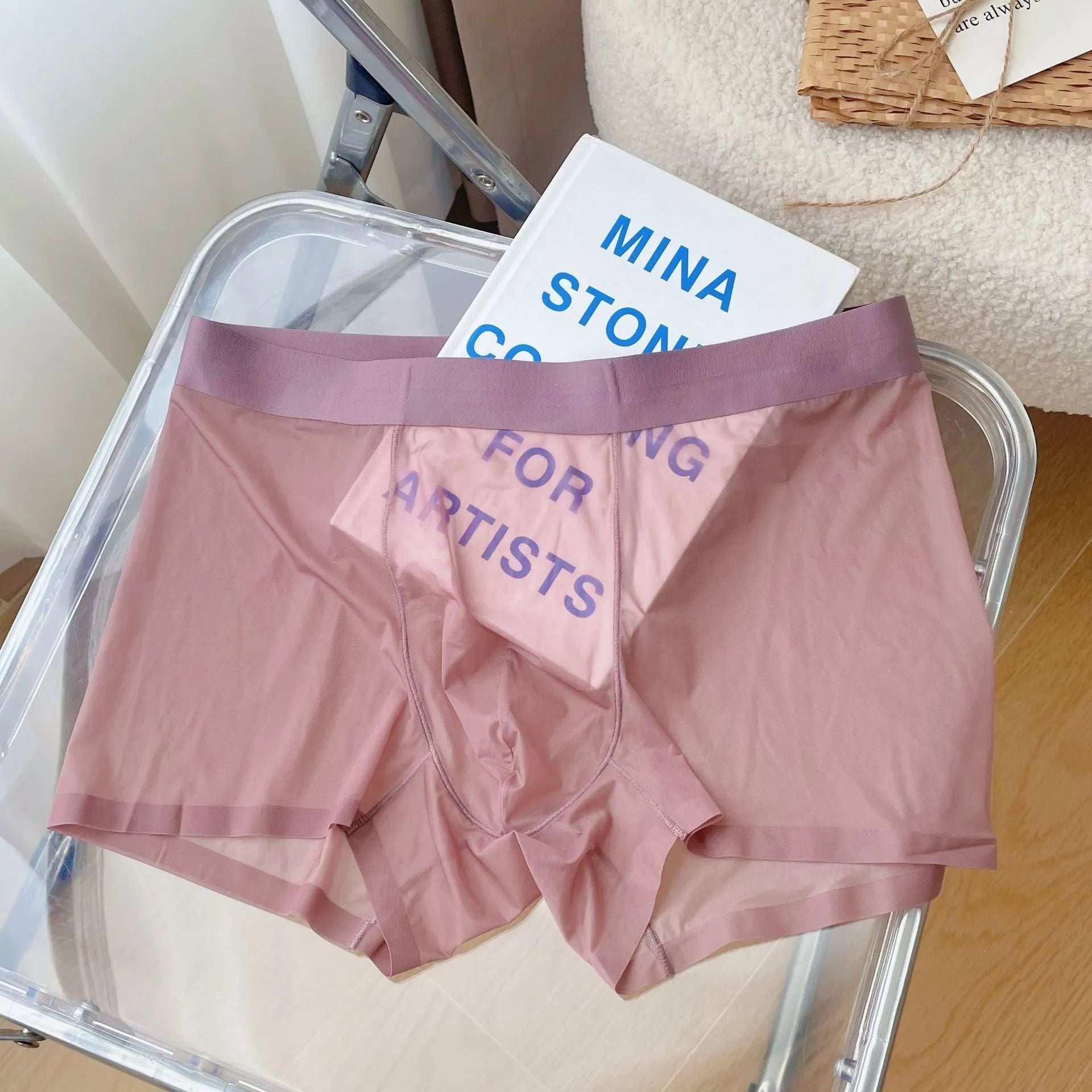 Man's thin grey breathable boxer shorts with a mid-waist and seamless design.