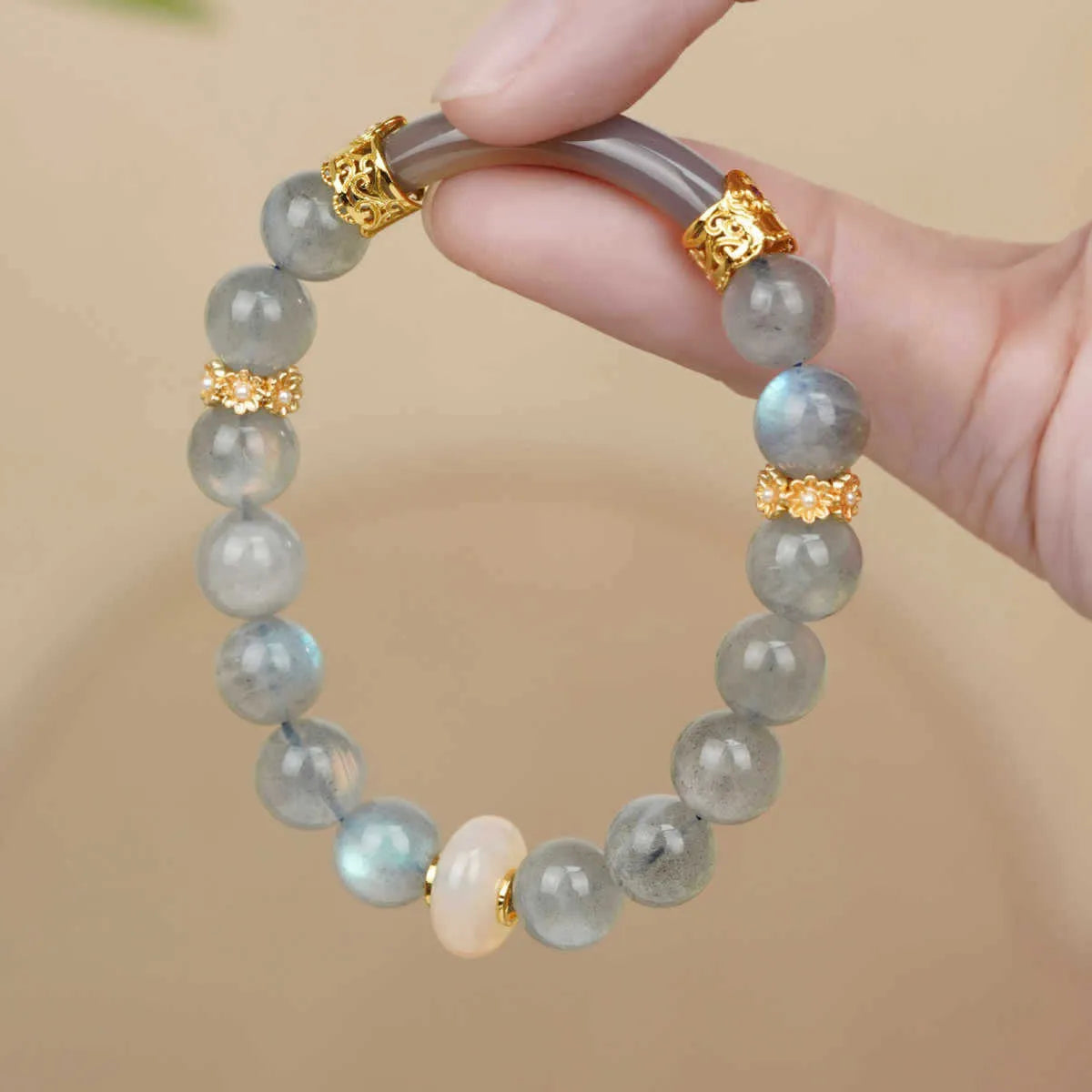 Light green emerald Tian Shan Cui half bracelet with floating flower girl motif on white background