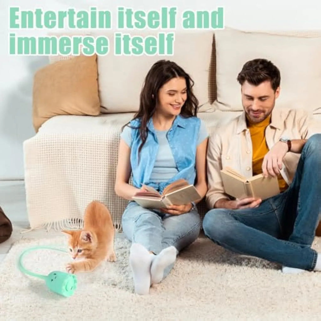Green automatic cat wand toy with swinging silicone tails for indoor cats on wooden floor