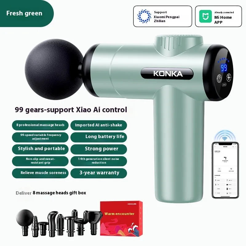 Konka V19 grey mini massage gun with multiple attachment heads on a table