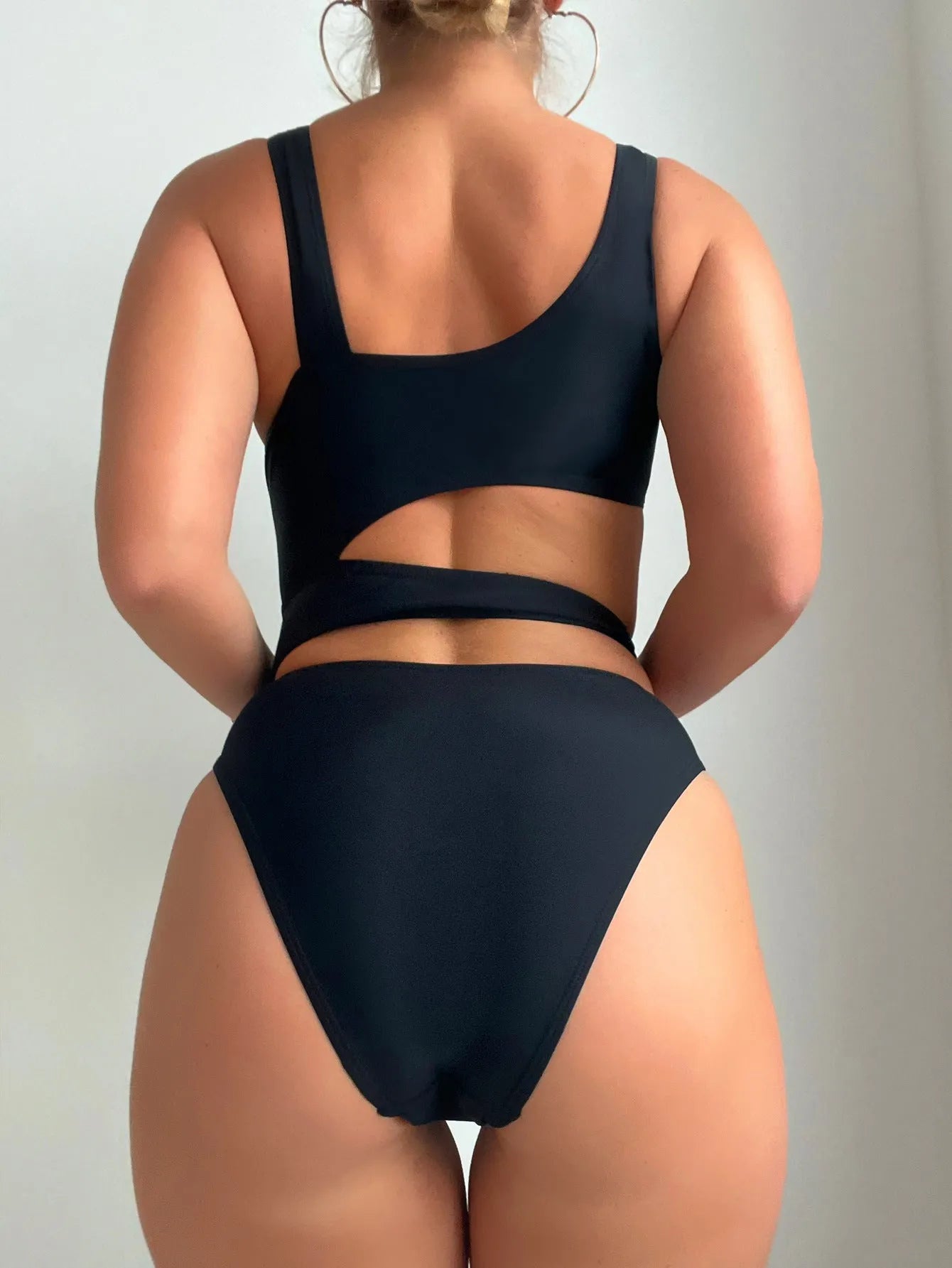 Black solid colour high cut hollow detail one-piece swimsuit for adult women