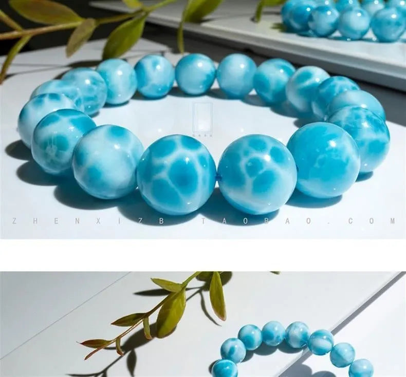 Blue handmade Bodhi bracelet with sea-pattern crystal stone and pearl accent in Maillard style.