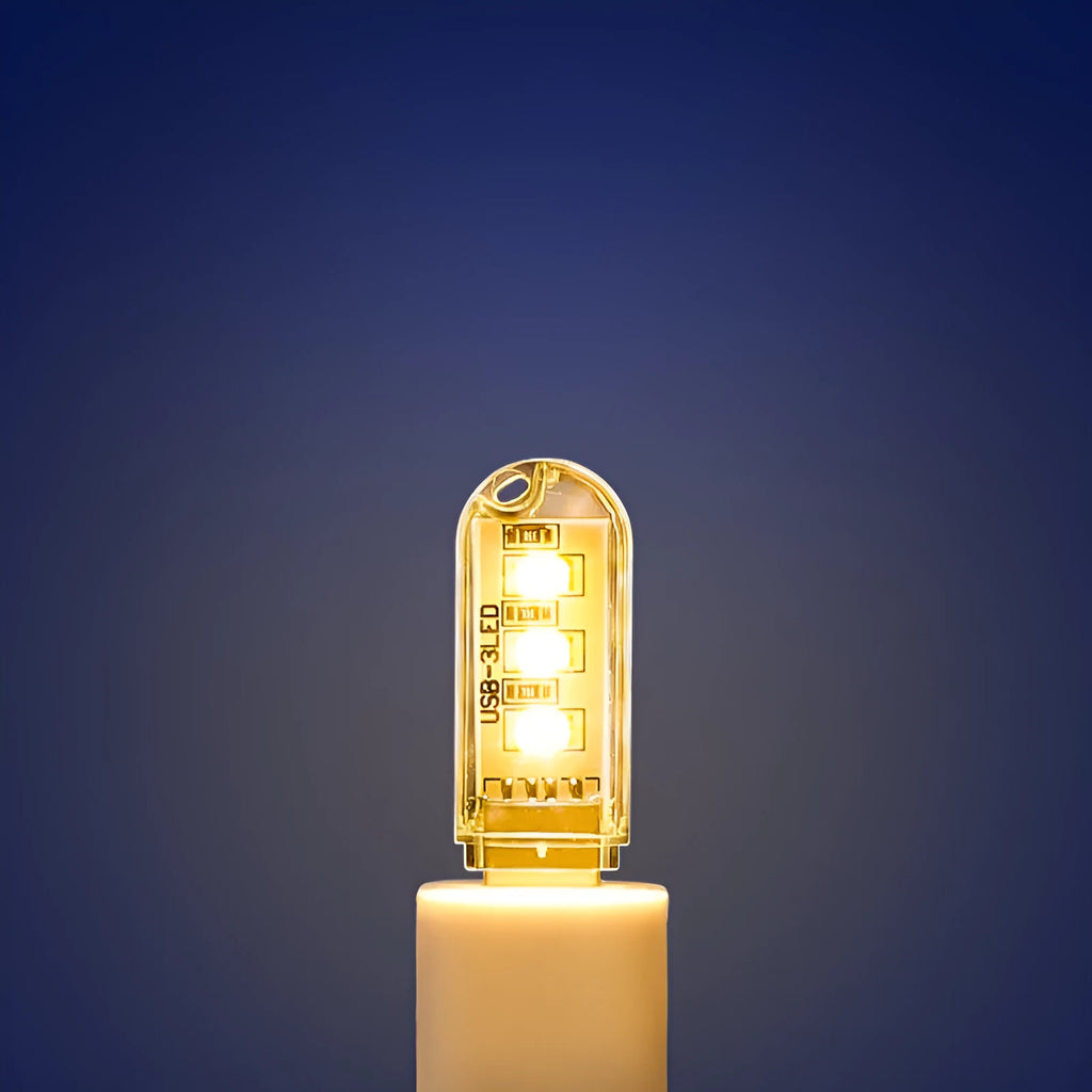 Compact white PC USB LED night light showing warm and white light colour options.
