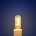 Compact white PC USB LED night light showing warm and white light colour options.