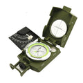 K4074 high-precision outdoor compass with metal body, hanging rope, and ring on a wooden surface