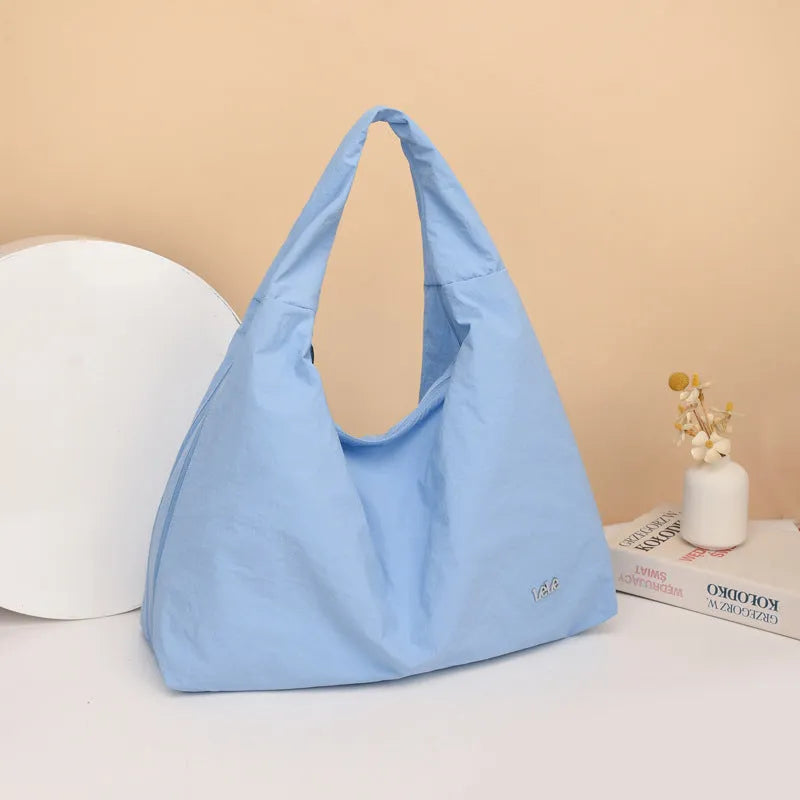 Heart-shaped women's nylon underarm bag in black, yellow, khaki, or blue with shoulder strap