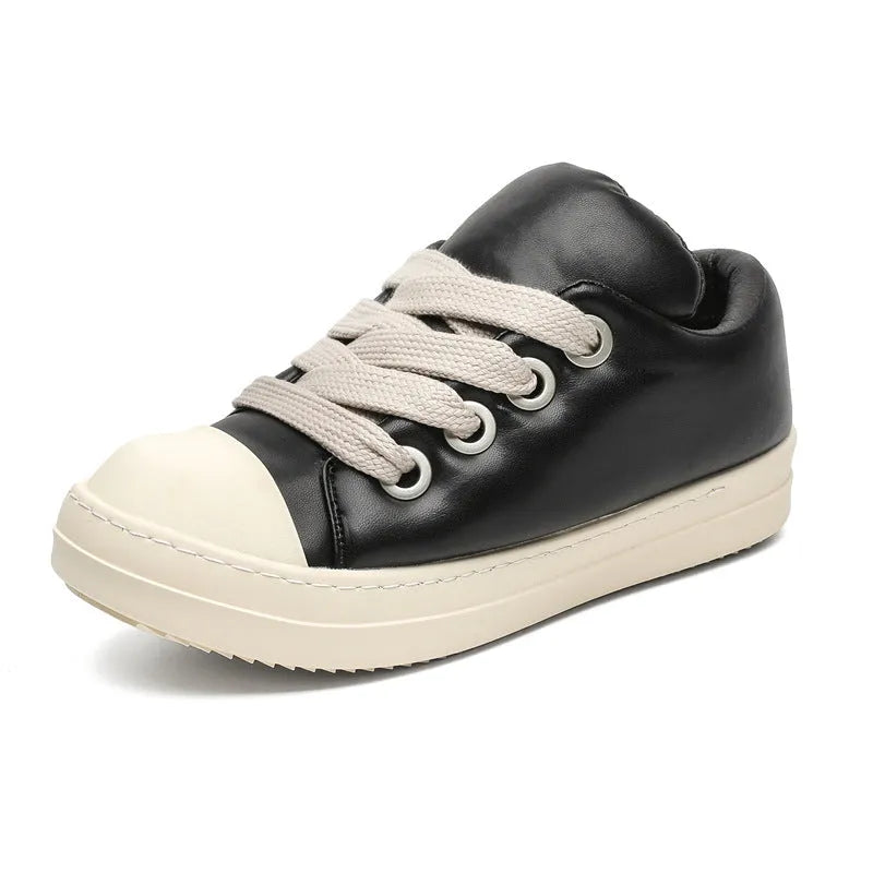 Men's black leather slip-on casual shoes with raised bottom board and round toe, side view