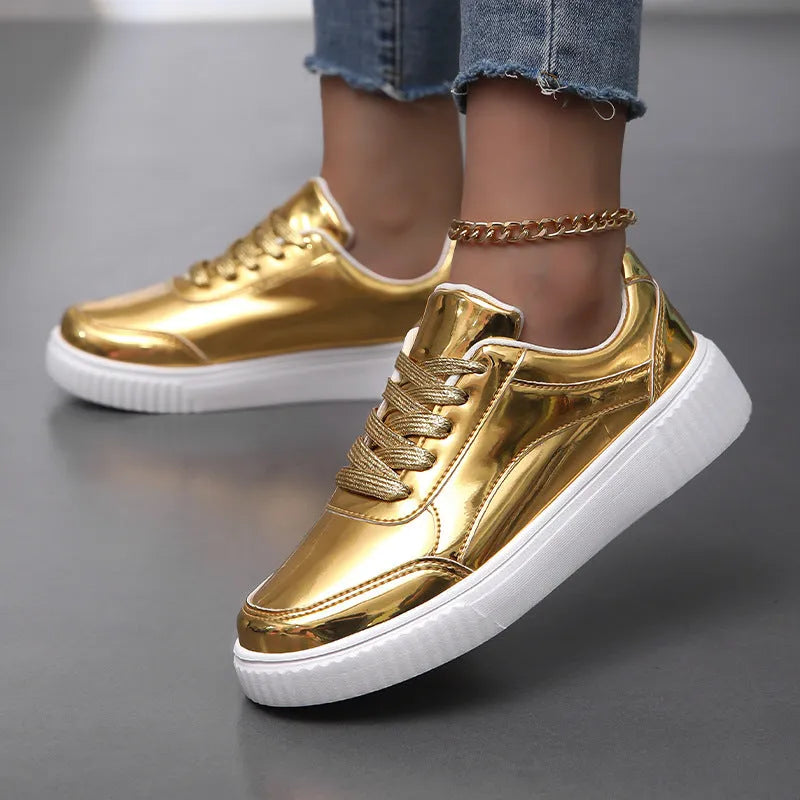 Gold sequined platform sneakers with round toe and thick MD sole on a white background.
