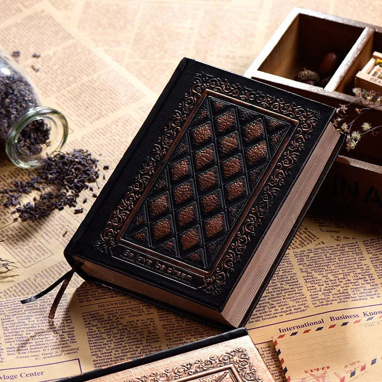 Embossed faux leather notepad showing three-dimensional geometric pattern in bronze colour with thick paper pages