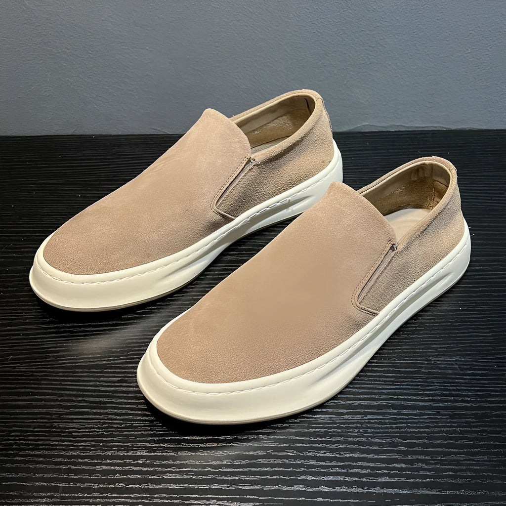 Men's casual shoes in solid grey colour with round toe, mid heel, and sewing line detail