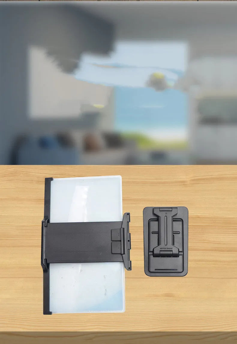 Black folding mobile phone screen amplifier with detachable phone holder magnifying smartphone display