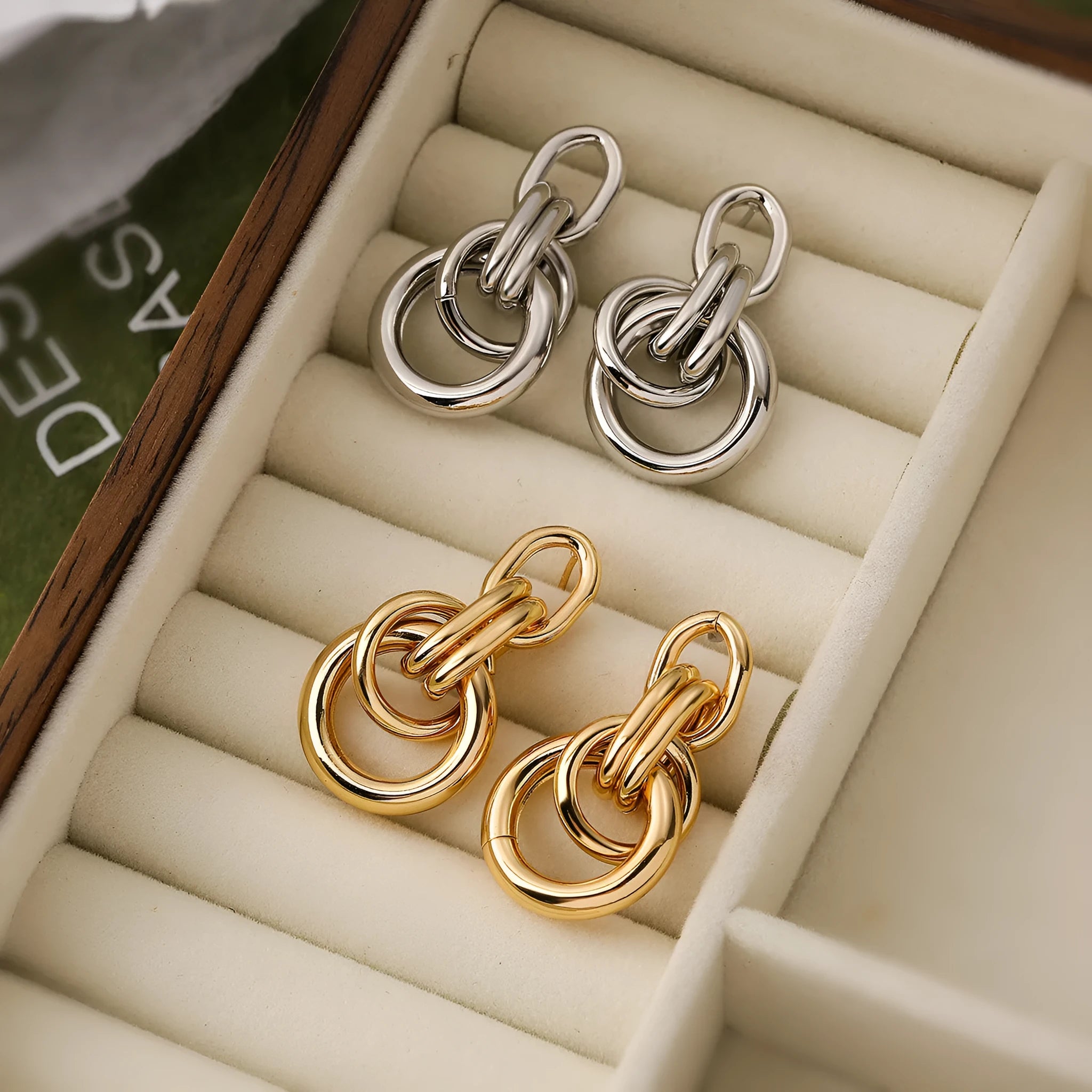 Gold-colour geometric copper earrings for women with an irregular, high-profile silhouette.