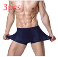 Man wearing dark blue ice silk modal boxer briefs with a U convex design and mid waist fit.