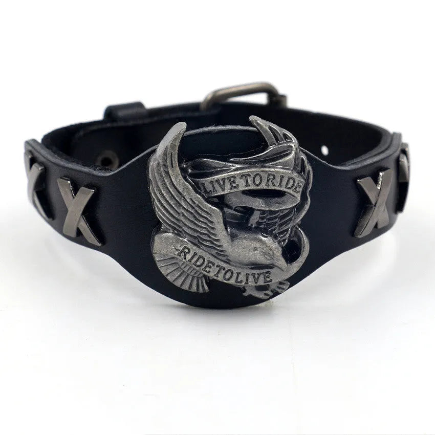 Black leather bracelet with geometric eagle watch-button clasp showing tapered 1.7-3.8cm width
