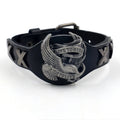 Black leather bracelet with geometric eagle watch-button clasp showing tapered 1.7-3.8cm width