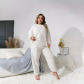 Women's creamy white polyester two-piece lounge suit with long sleeves and trousers