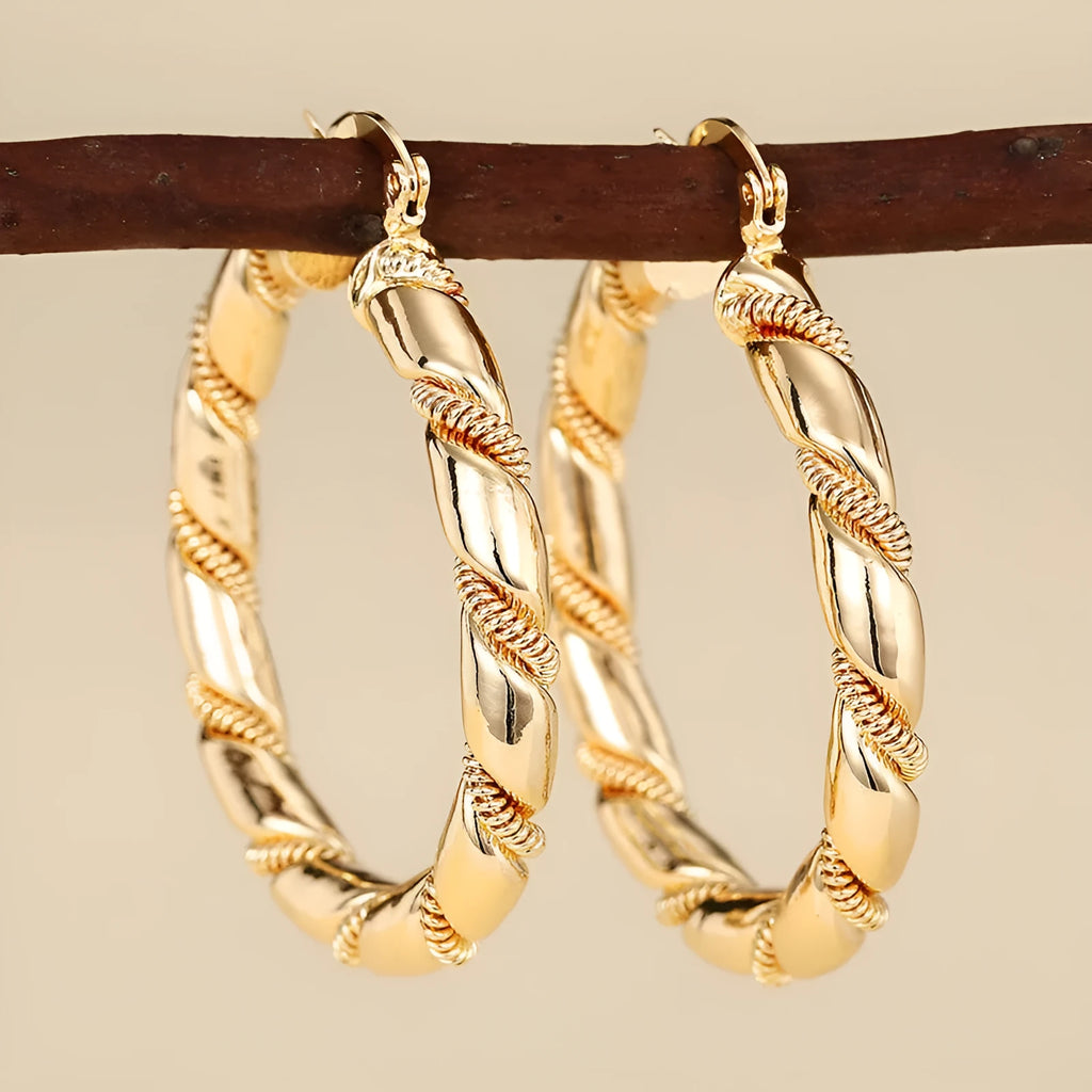 Geometric copper earrings for women with ring and line elements in golden colour
