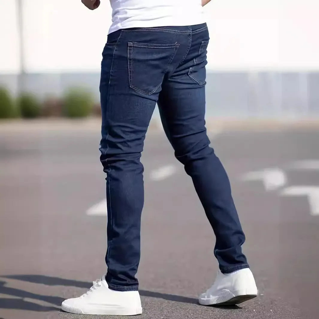 Dark blue men's slim fit skinny jeans with stretch cotton fabric on a mid waist.