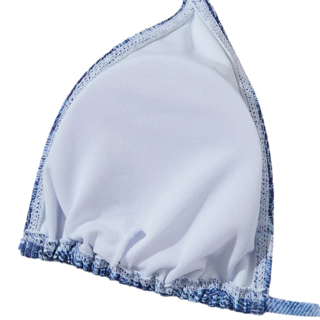 Denim blue printed women's bikini set with strappy triangle top and matching bottoms on a neutral background.