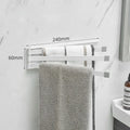 Black folding non-perforated towel bar on tiled bathroom wall, nail-free adhesive installation