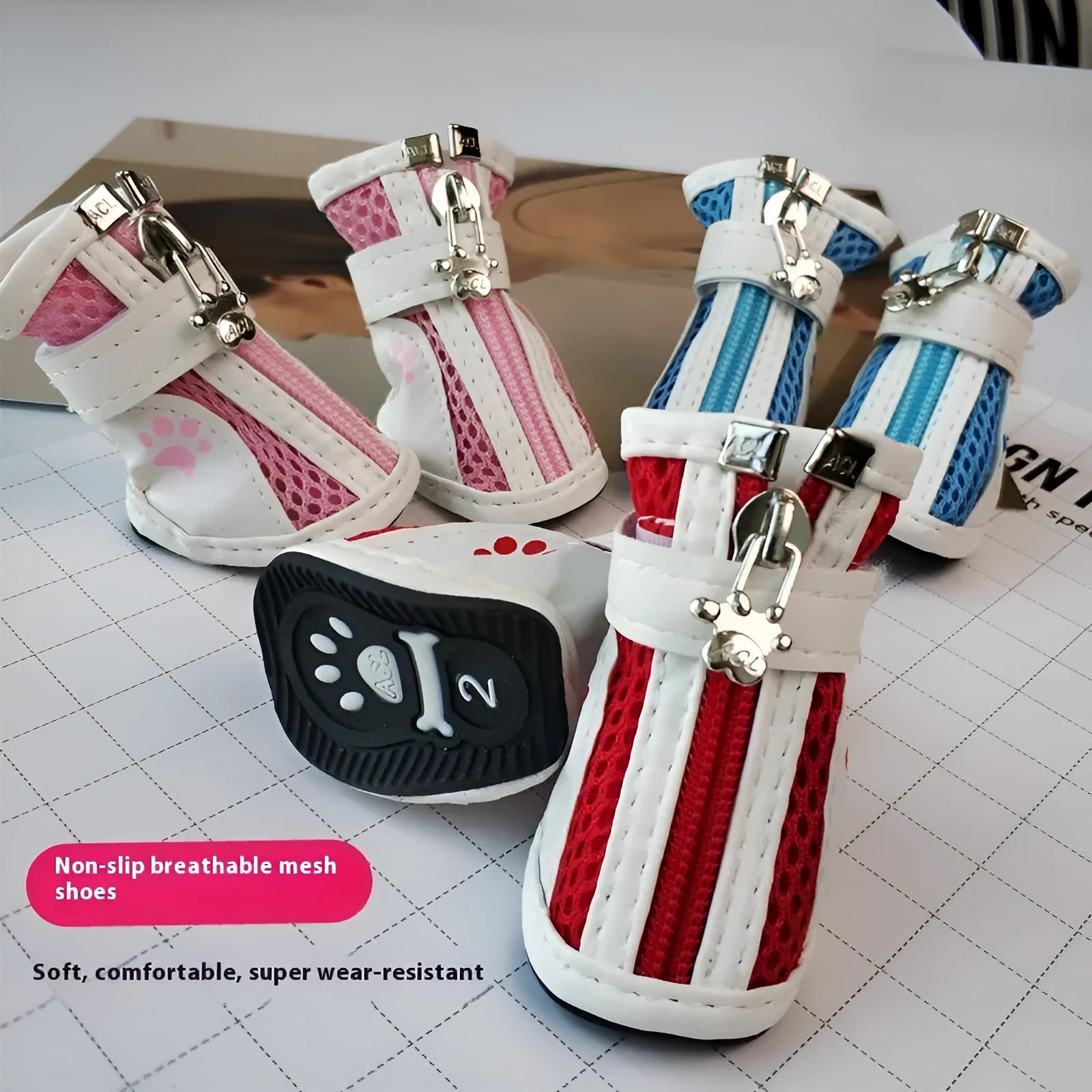 Four blue cloth dog sneakers with zipper closures and non-slip soles for small breeds
