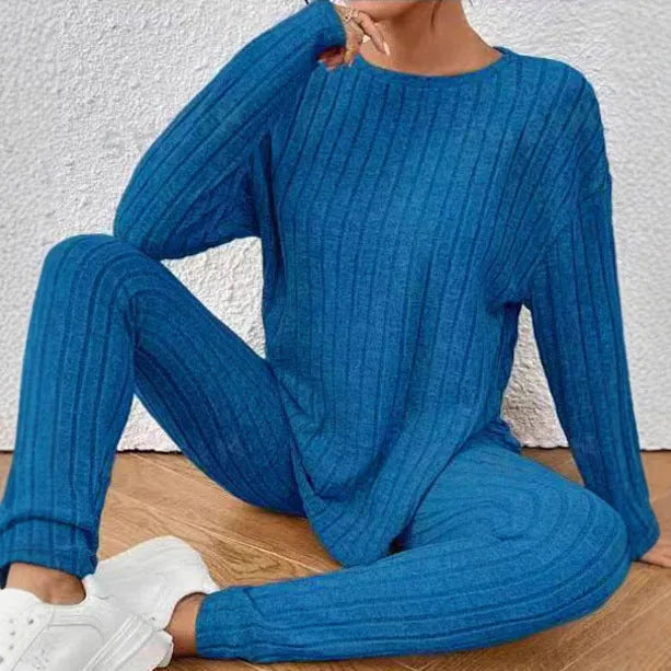 Women's black sunken stripe polyester two-piece loungewear set with regular sleeve top and matching trousers