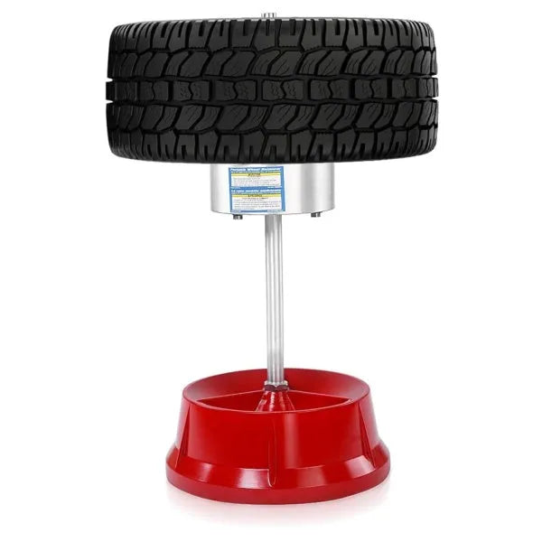 Portable manual hub balancer with aluminium head and bull's eye level on enamel base.