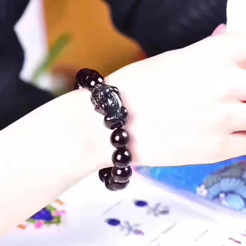 Natural ice colour eye obsidian crystal bracelet showing bead texture and sizing options
