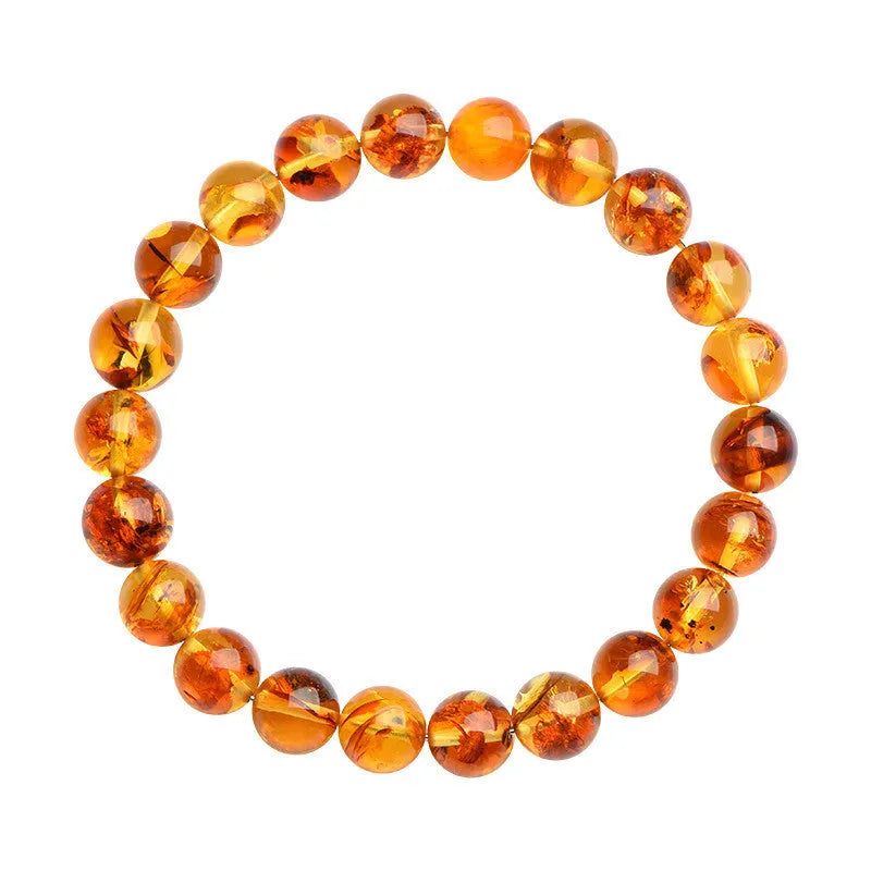 Natural yellow piebald amber bracelet with geometric beads and polished finish