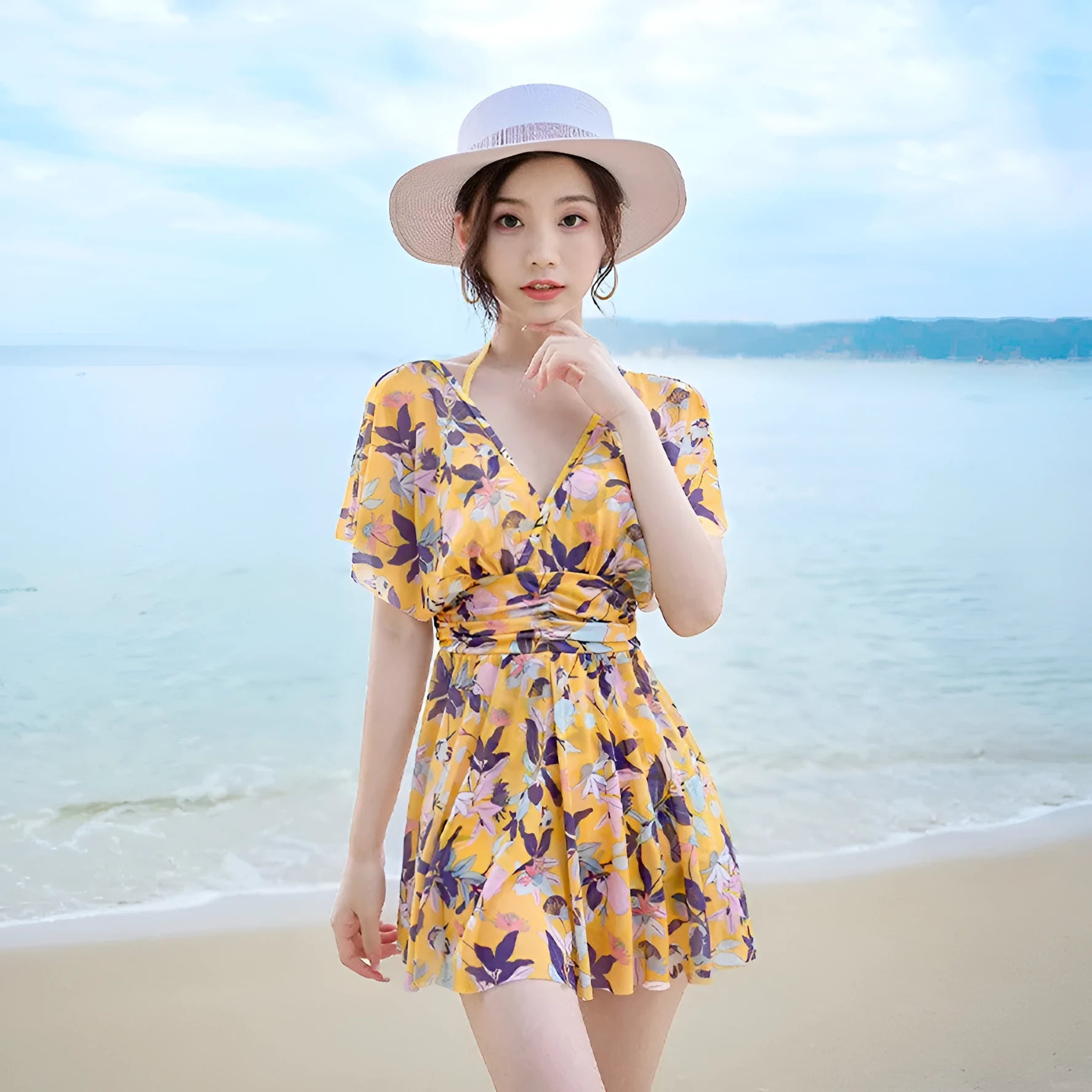 Women's yellow floral one-piece swimsuit made from polyester with full coverage design