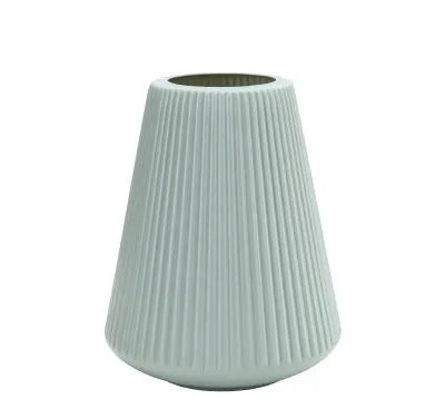 Colourful melamine plastic decorative flower vase on a desktop, 16cm wide by 20cm tall.