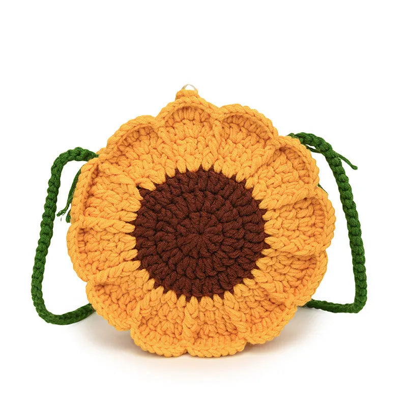 Hand-woven round wool bag with crocheted flowers and cotton lining in yellow, green, light blue, and royal blue