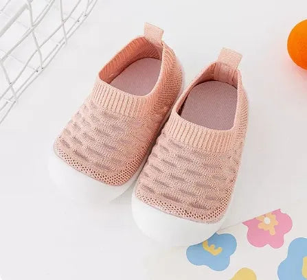 Baby soft sole non-slip walking shoes in cream yellow with fly woven cotton upper and natural rubber sole