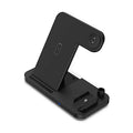 Black four-in-one wireless charger N18 for mobile phones with QC3.0 charging head on a desk