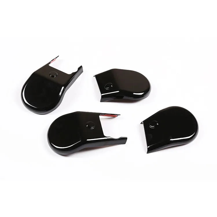 Black plastic seat feet screw decoration covers for 15-21 Toyota Hi Lux, 4 piece set on a white background