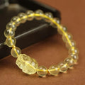 Yellow Citrine Pi Xiu bracelet with artificial crystal beads and leather clasp in national style.