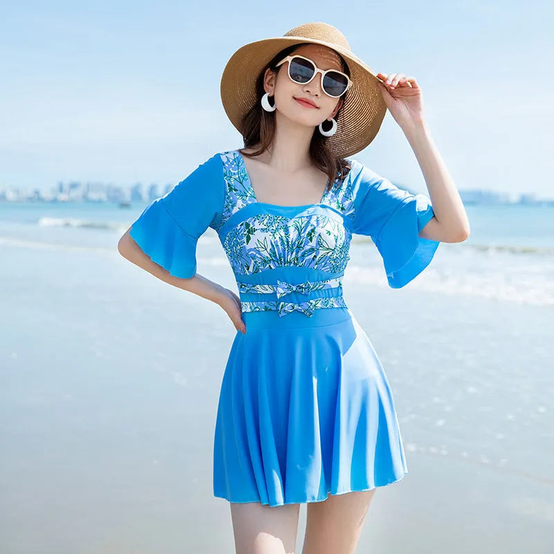 Women's one-piece swimsuit with seaside print in green and blue colourways, chemical fibre blend fabric