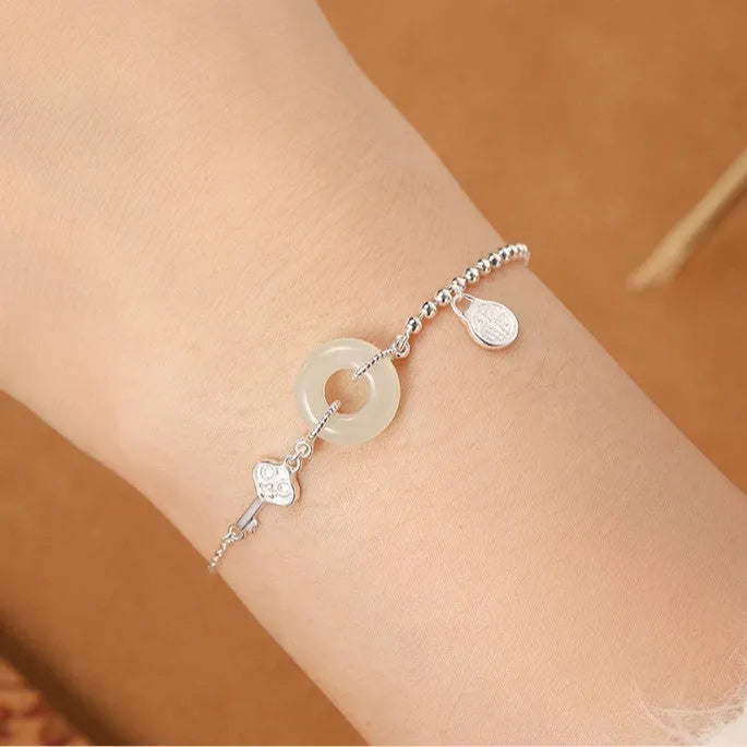 Silver Hetian jade bracelet with blessing card and peace buckle design in geometric Chinese style