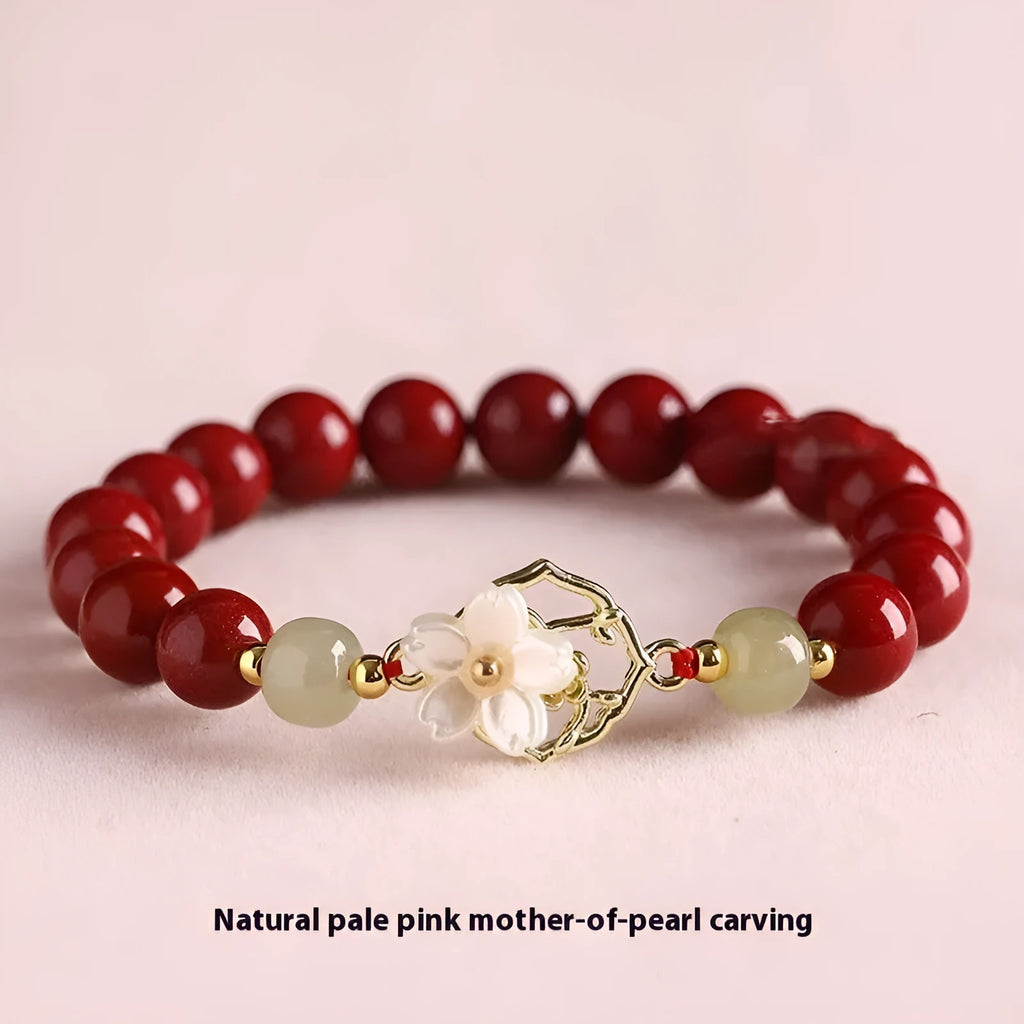 Natural Hetian jade white butterfly Bells of Ireland sinology bracelet with cinnabar beads and lotus motif on women's wrist