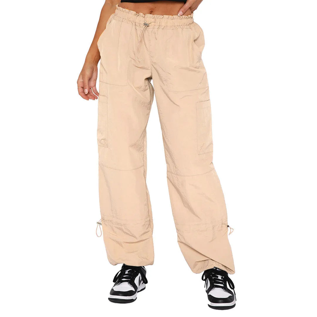Men's loose-fit straight-leg cargo trousers in khaki with multiple pockets, showing the relaxed silhouette.