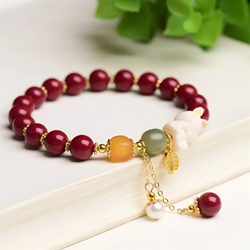 Natural cinnabar rabbit charm bracelet in Chinese national style, available in 8mm or 10mm diameters